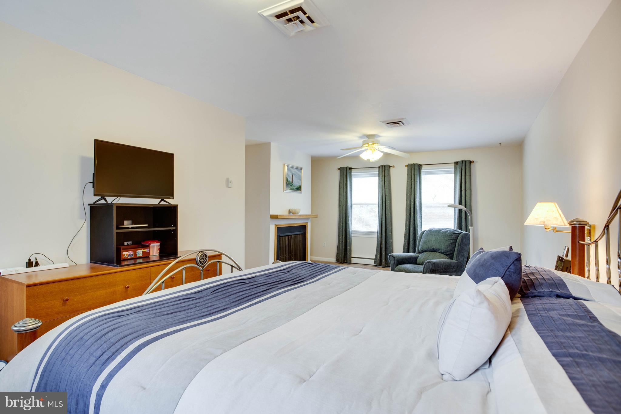 11633 Rivershore Drive Dunkirk, MD 20754 - Photo 20 of 29 a bed room with a bed and a tv