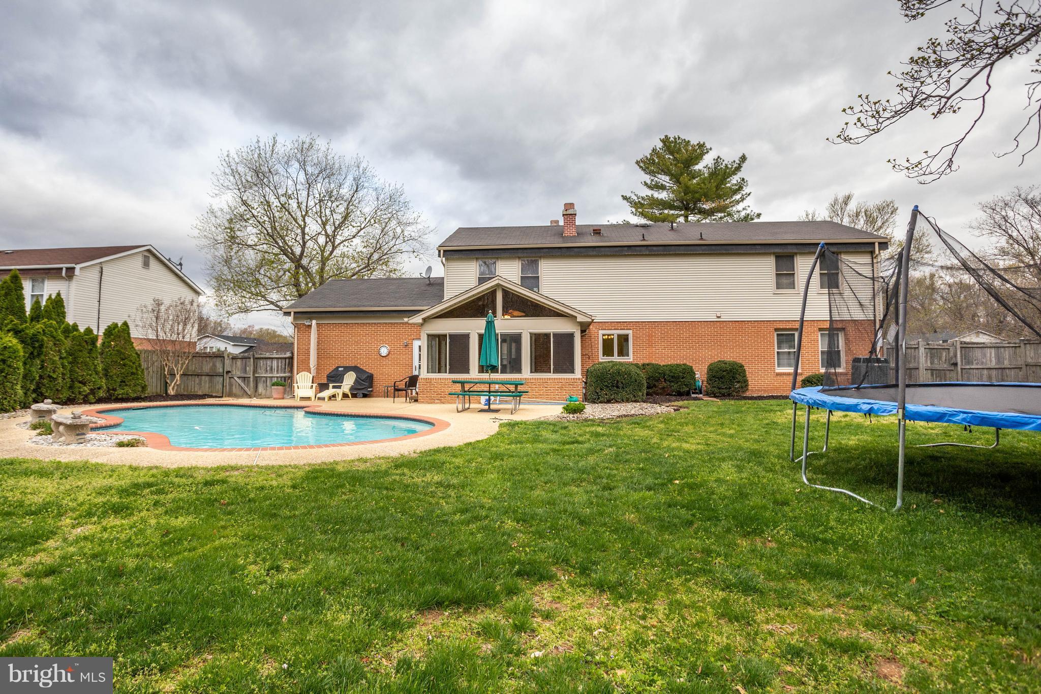 11633 Rivershore Drive Dunkirk, MD 20754 - Photo 3 of 29 a view of house with yard and swimming pool