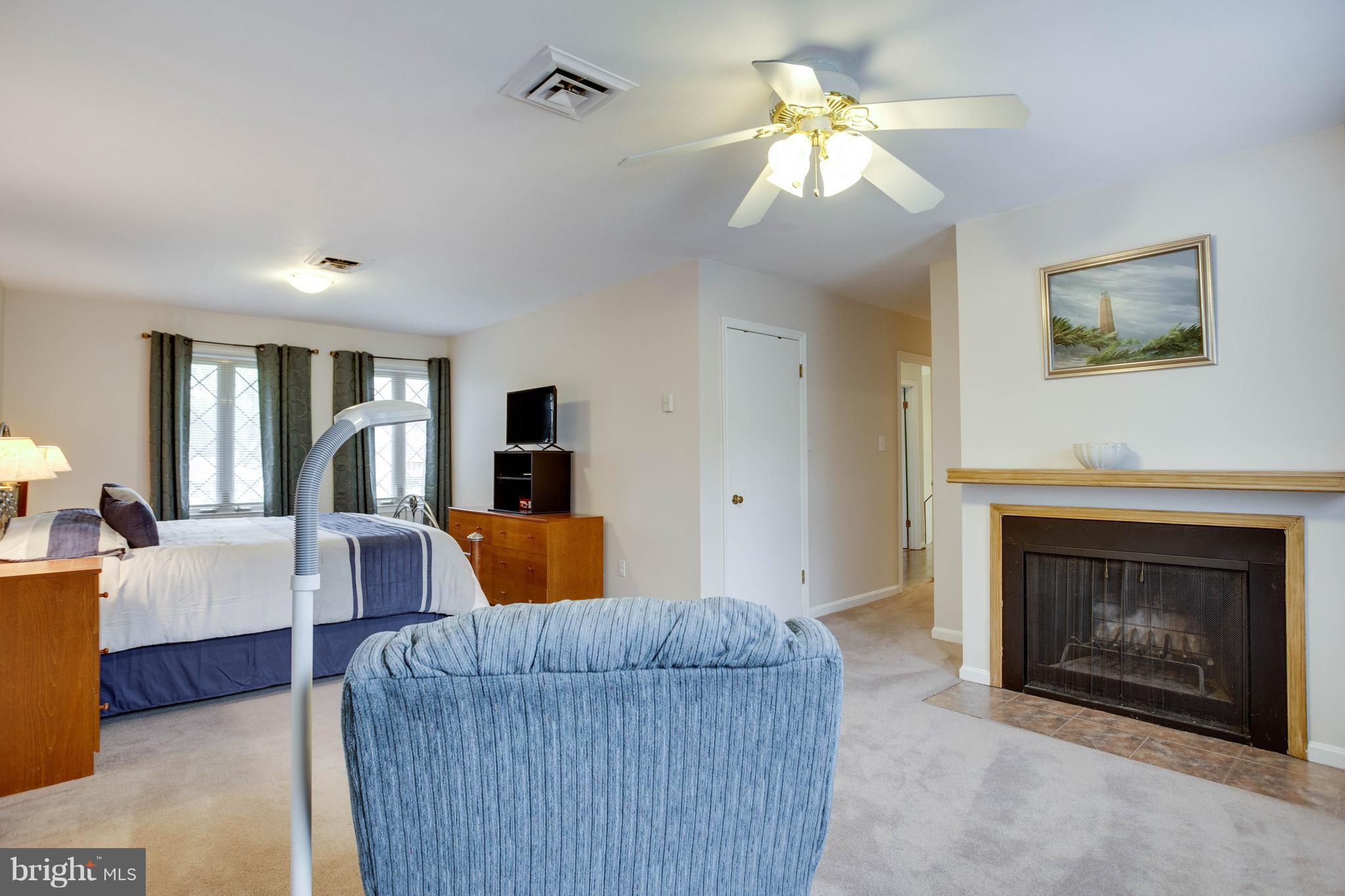 11633 Rivershore Drive Dunkirk, MD 20754 - Photo 21 of 29 a living room with furniture and a fireplace