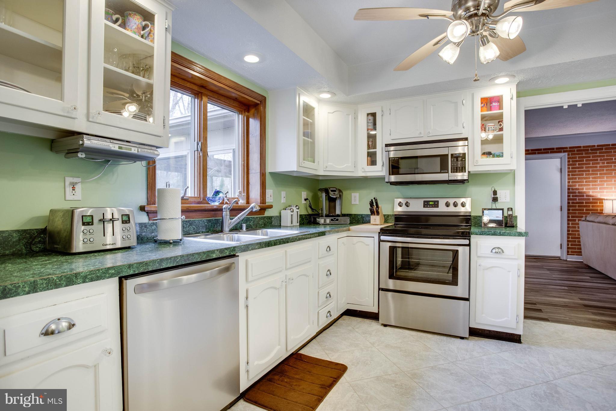 11633 Rivershore Drive Dunkirk, MD 20754 - Photo 10 of 29 a kitchen with stainless steel appliances granite countertop a sink a stove and cabinets