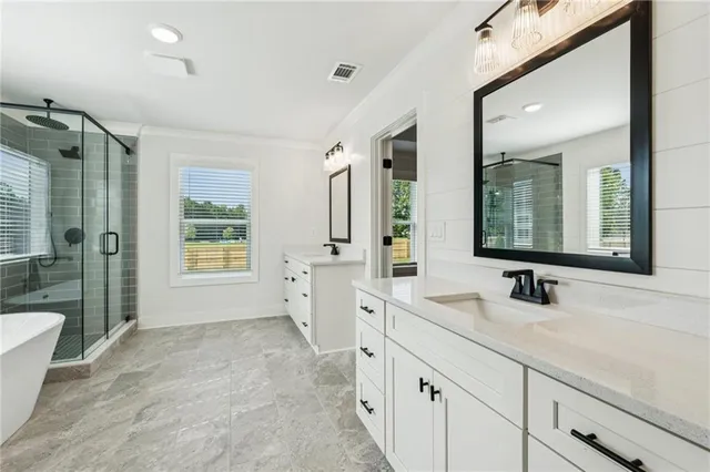 a bathroom with a sink and shower
