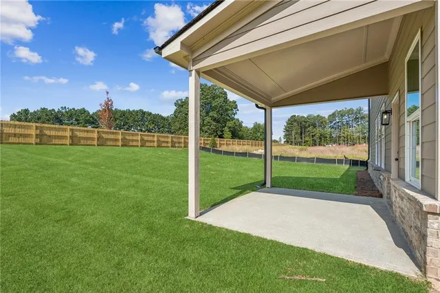 a view of a backyard with a lake view