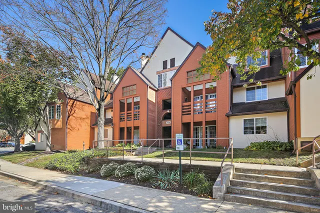 a view of multiple houses with a yard