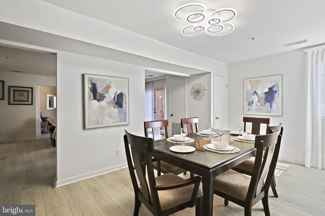 a open dining room with furniture and window