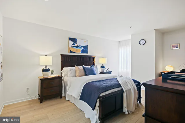 a view of walk in closet with clothes