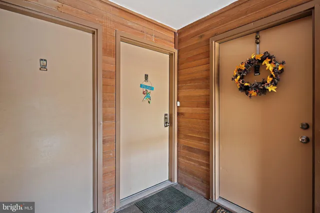 a living room with furniture and a lamp
