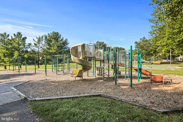 a view of a swimming pool with a yard