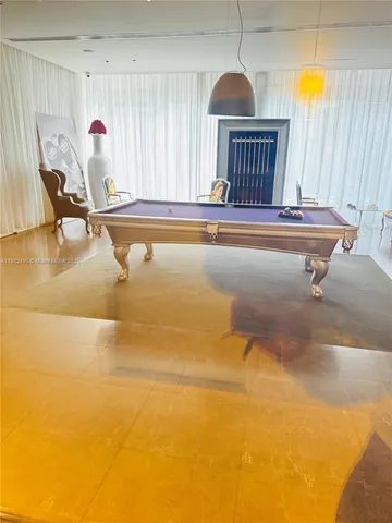 a bathroom with a tub sink and window