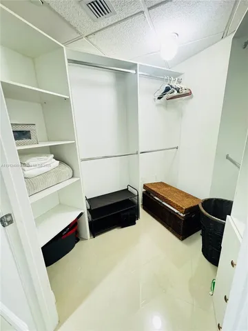 a bedroom with a bed and a cabinets
