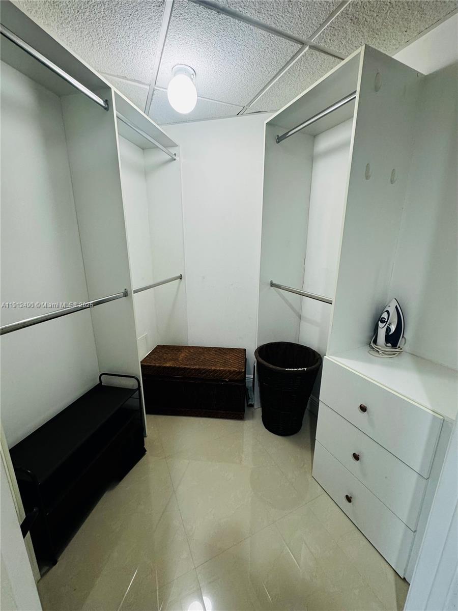 475 Brickell Avenue, Unit 808 Miami, FL 33131 - Photo 8 of 19 a bedroom with a bed and a couch