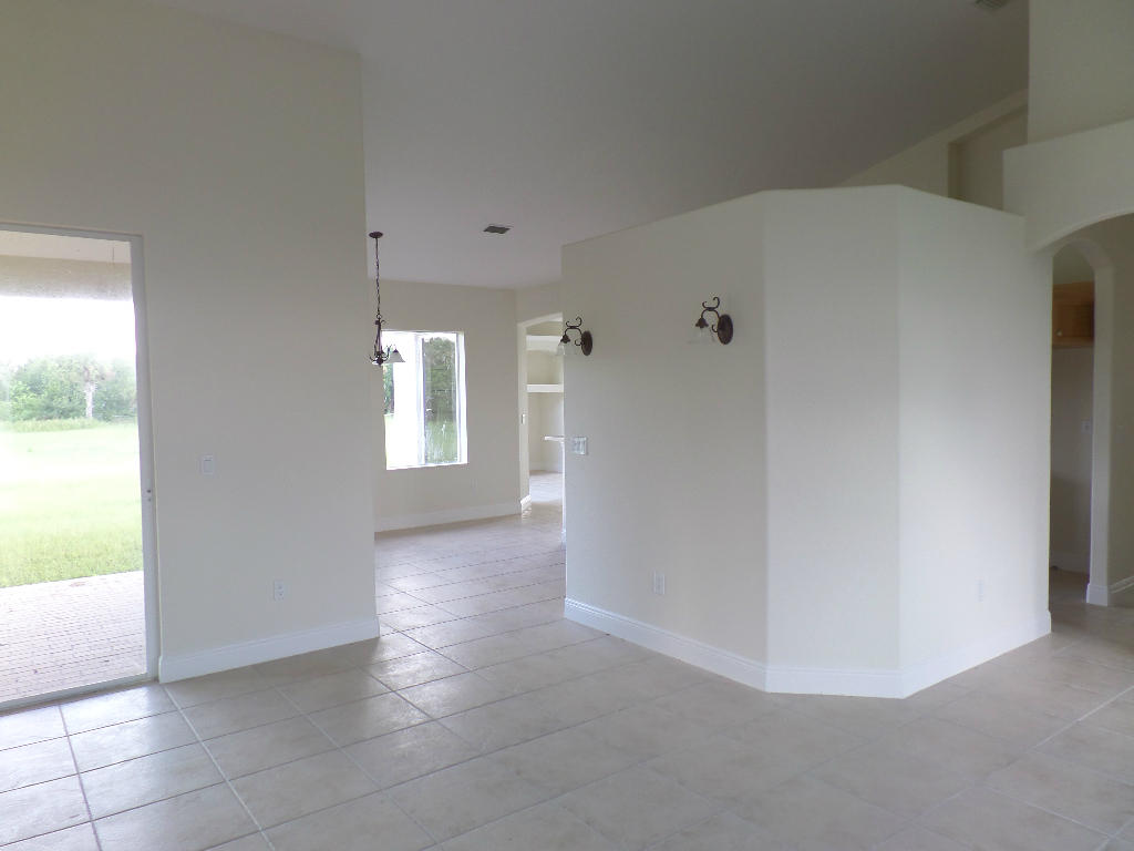 6340 Floyd Johnson Road Fort Pierce, FL 34947 - Photo 11 of 40 hall to kitchen - Copy