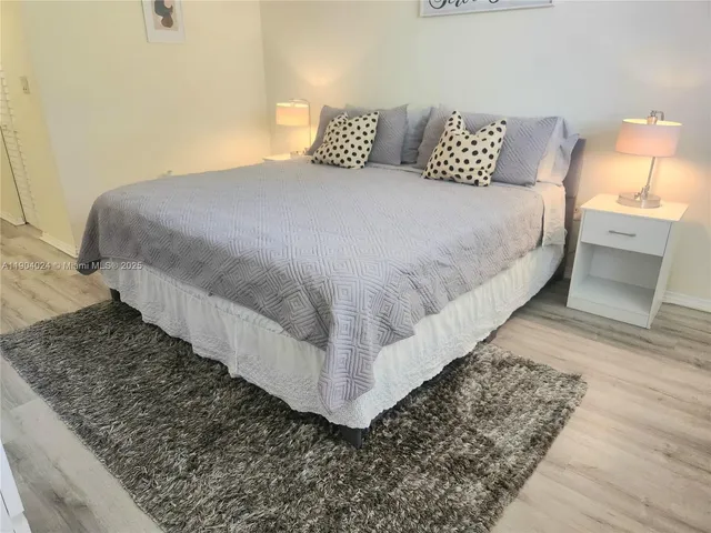 a bedroom with bed and window