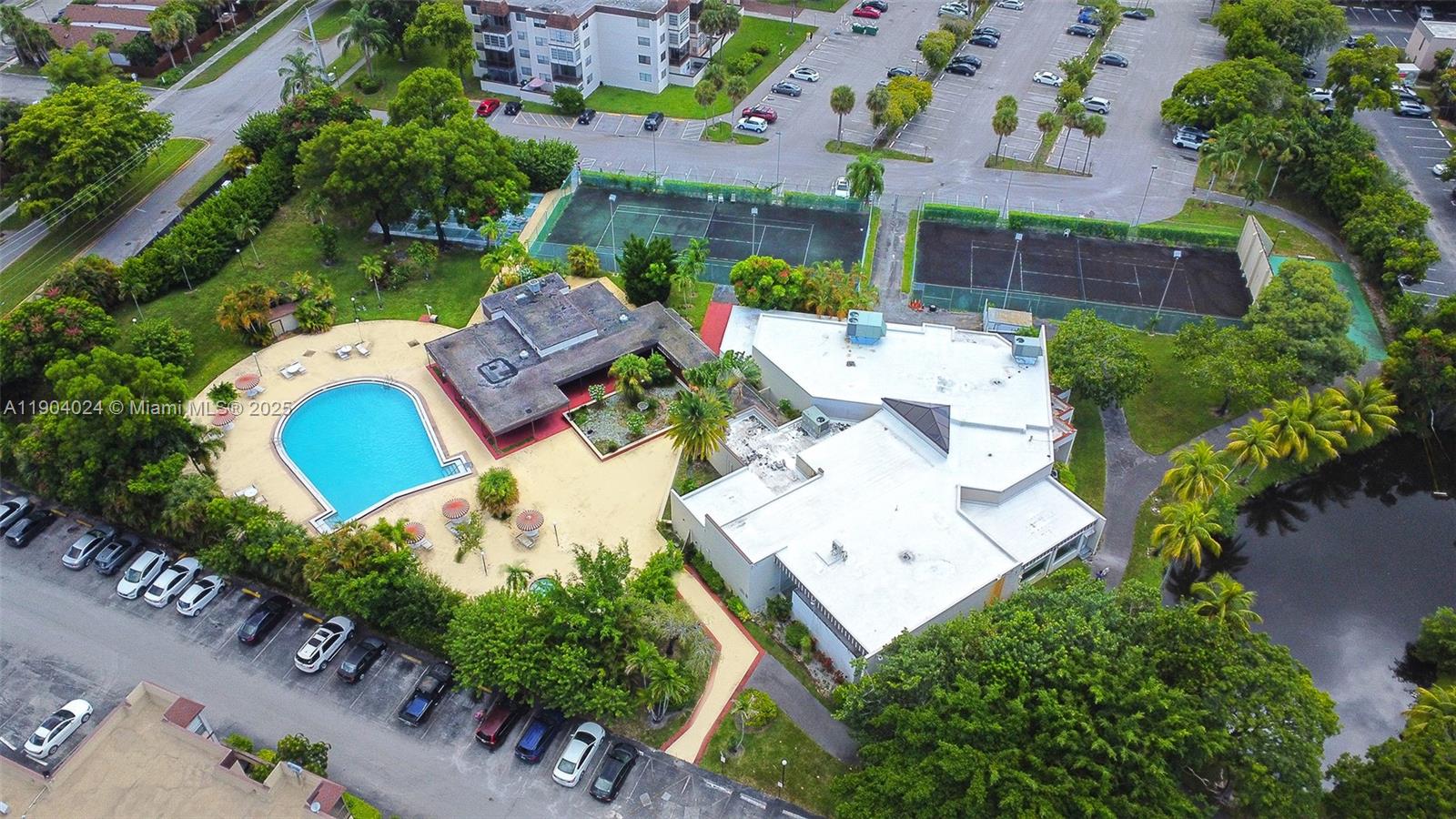 7300 Northwest 17th Street, Unit 220 Plantation, FL 33313 - Photo 25 of 27 an aerial view of a house with a yard and garden