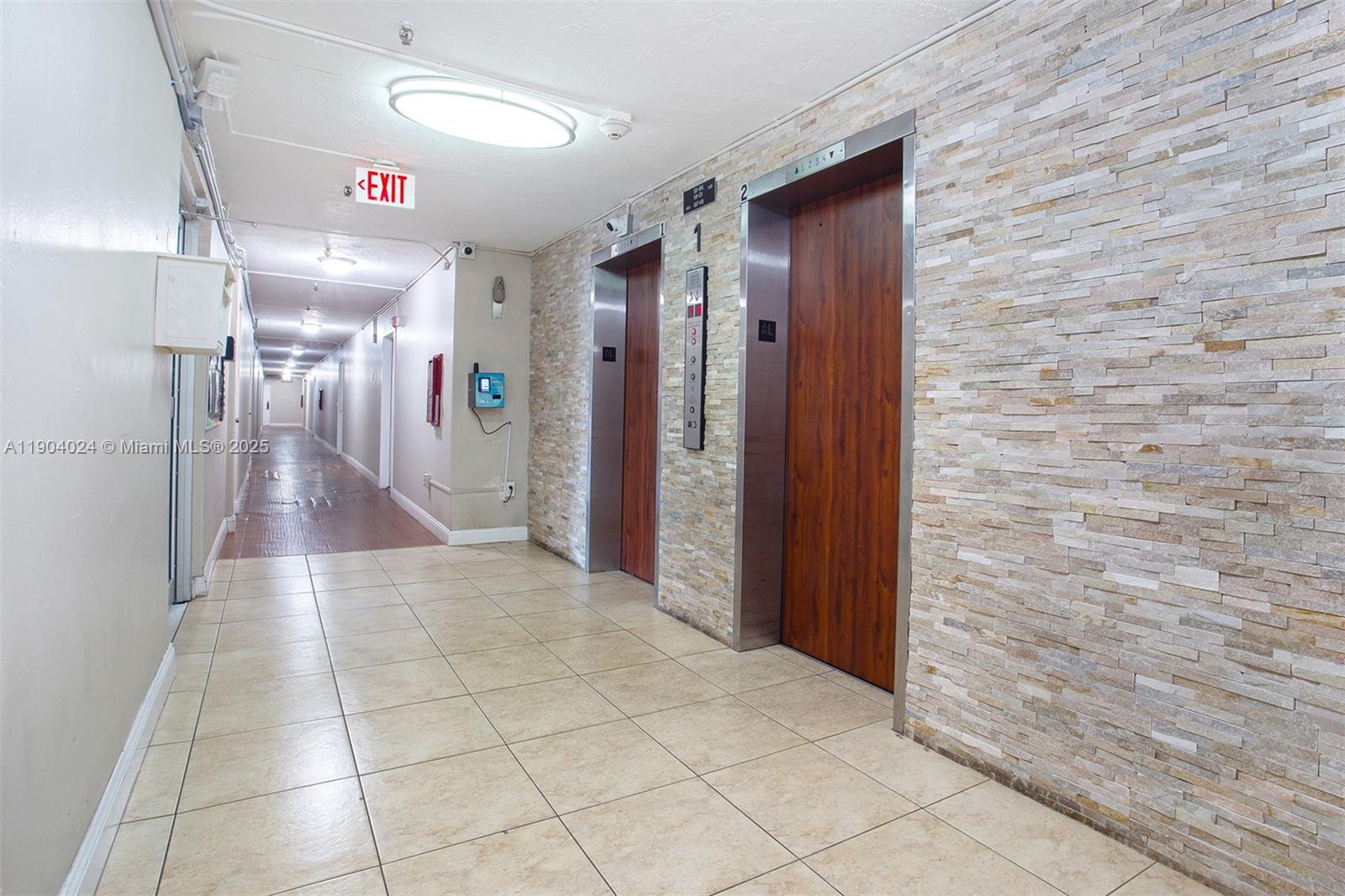 7300 Northwest 17th Street, Unit 220 Plantation, FL 33313 - Photo 26 of 27 a view of a hallway