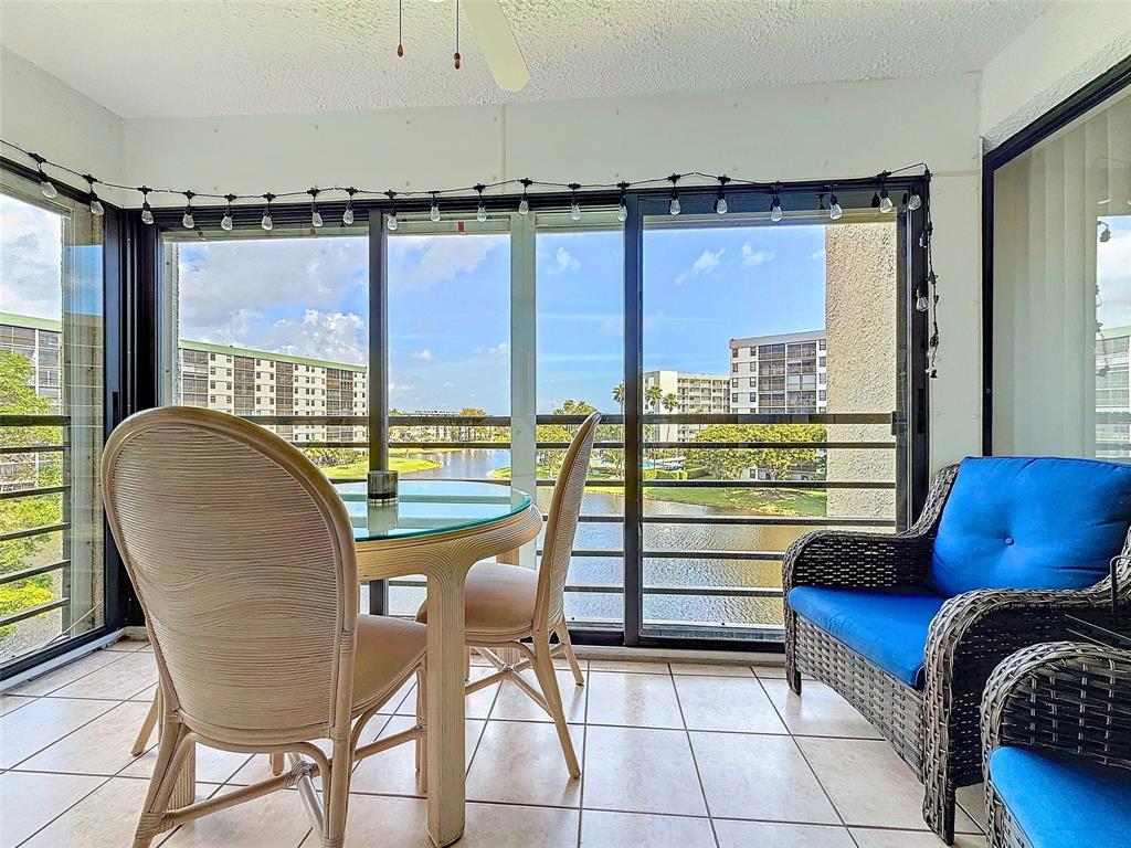 2309 South Cypress Bend Drive, Unit 515 Pompano Beach, FL 33069 - Photo 12 of 14 a workspace with furniture and a window