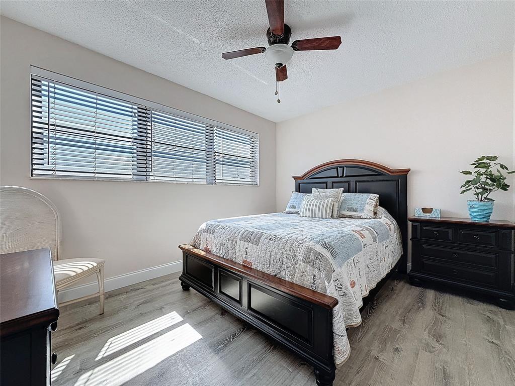 2309 South Cypress Bend Drive, Unit 515 Pompano Beach, FL 33069 - Photo 10 of 14 a bedroom with a bed and window