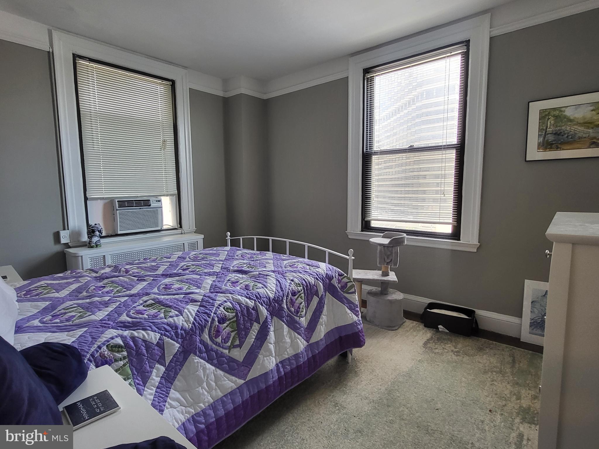 2031 Locust Street, Unit 801 Philadelphia, PA 19103 - Photo 12 of 23 a bedroom with a bed next to a window