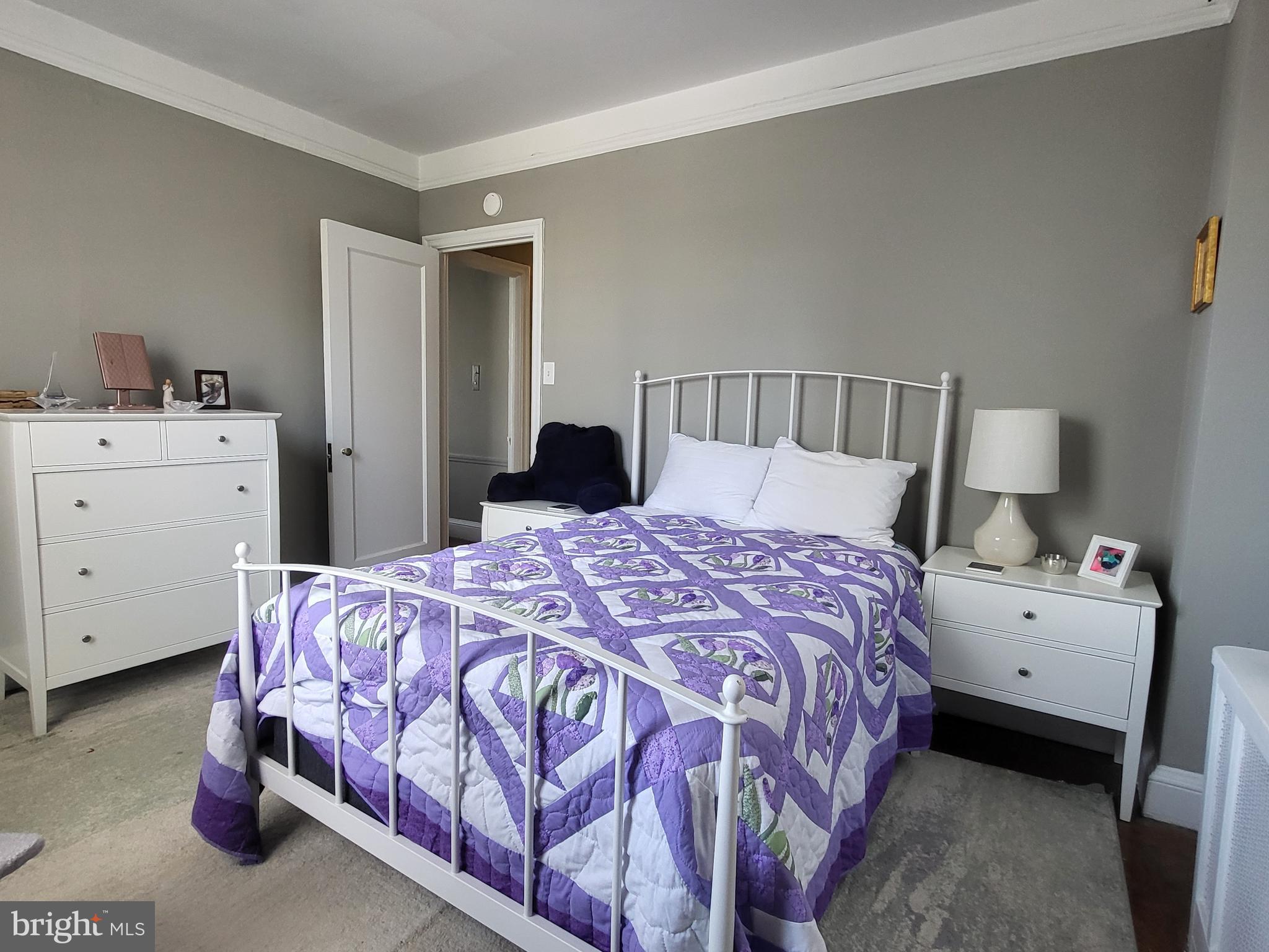 2031 Locust Street, Unit 801 Philadelphia, PA 19103 - Photo 13 of 23 a bedroom with a bed and a dresser