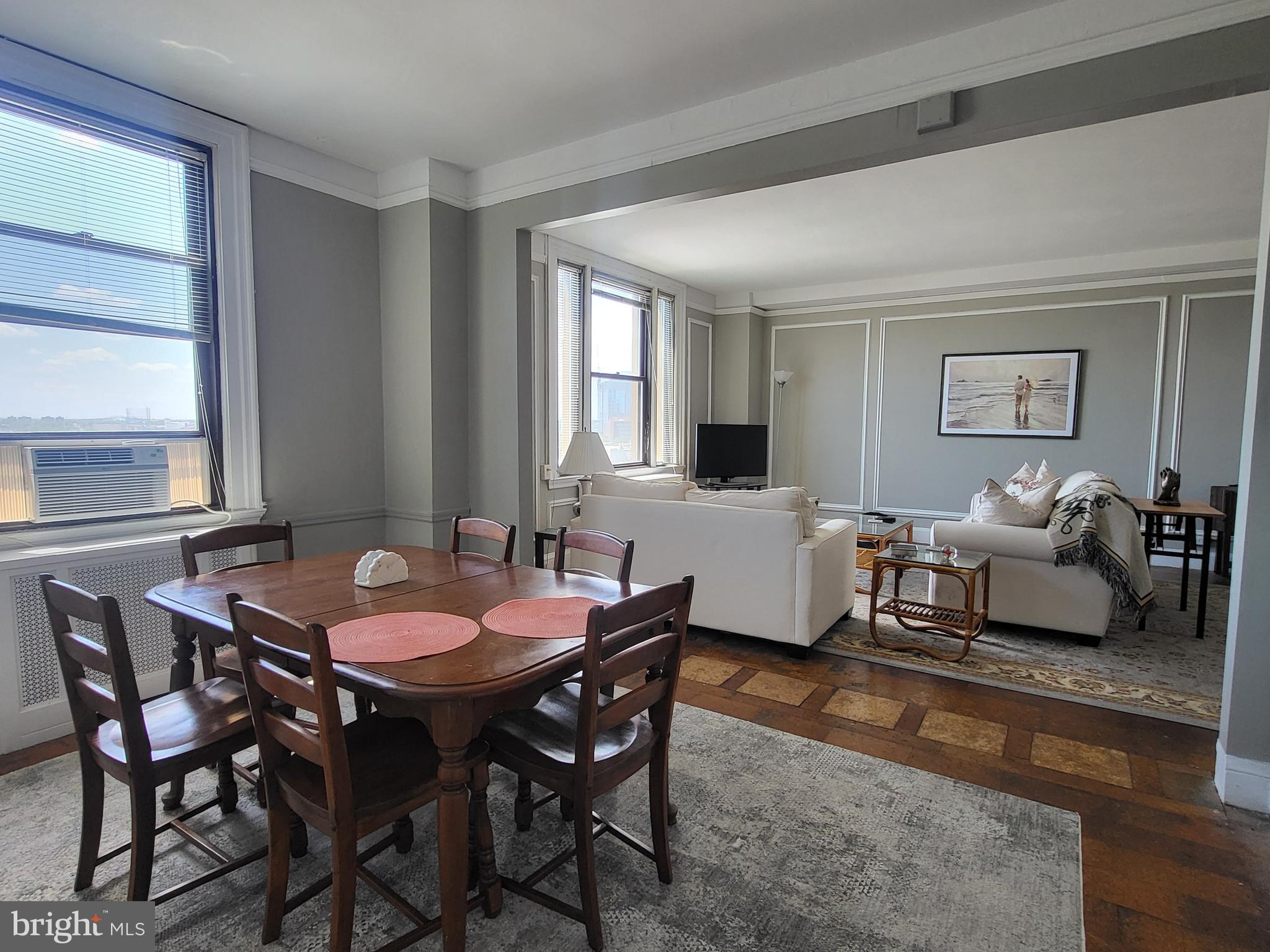 2031 Locust Street, Unit 801 Philadelphia, PA 19103 - Photo 5 of 23 a view of a dining room with furniture and window