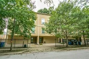 front view of a house with a tree