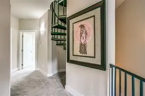 a view of a hallway with paintings on the wall