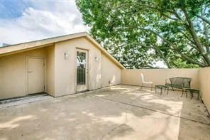 a view of backyard with outdoor seating and garage