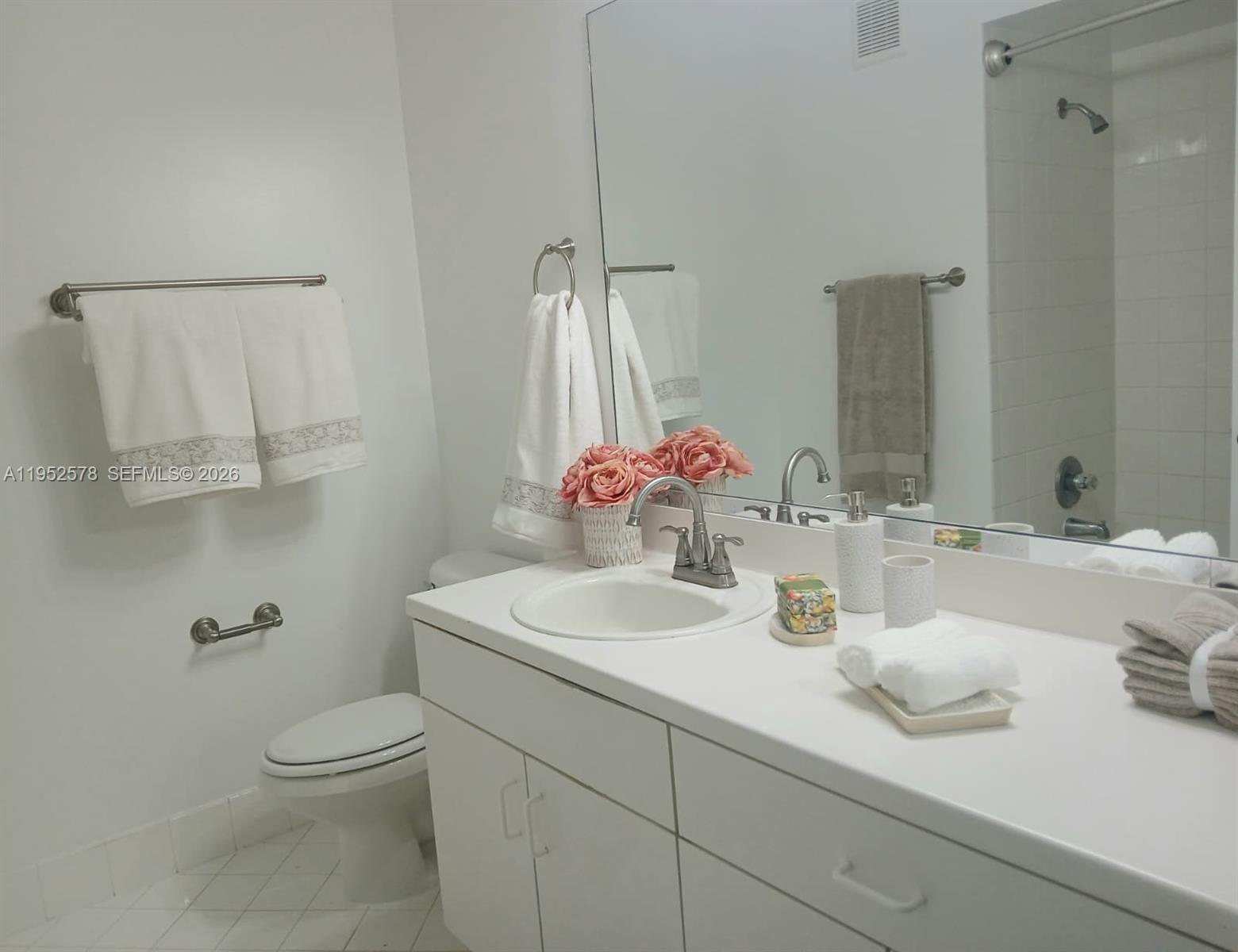 3618 San Simeon Circle, Unit 3618 Weston, FL 33331 - Photo 15 of 44 a bathroom with a sink toilet and mirror