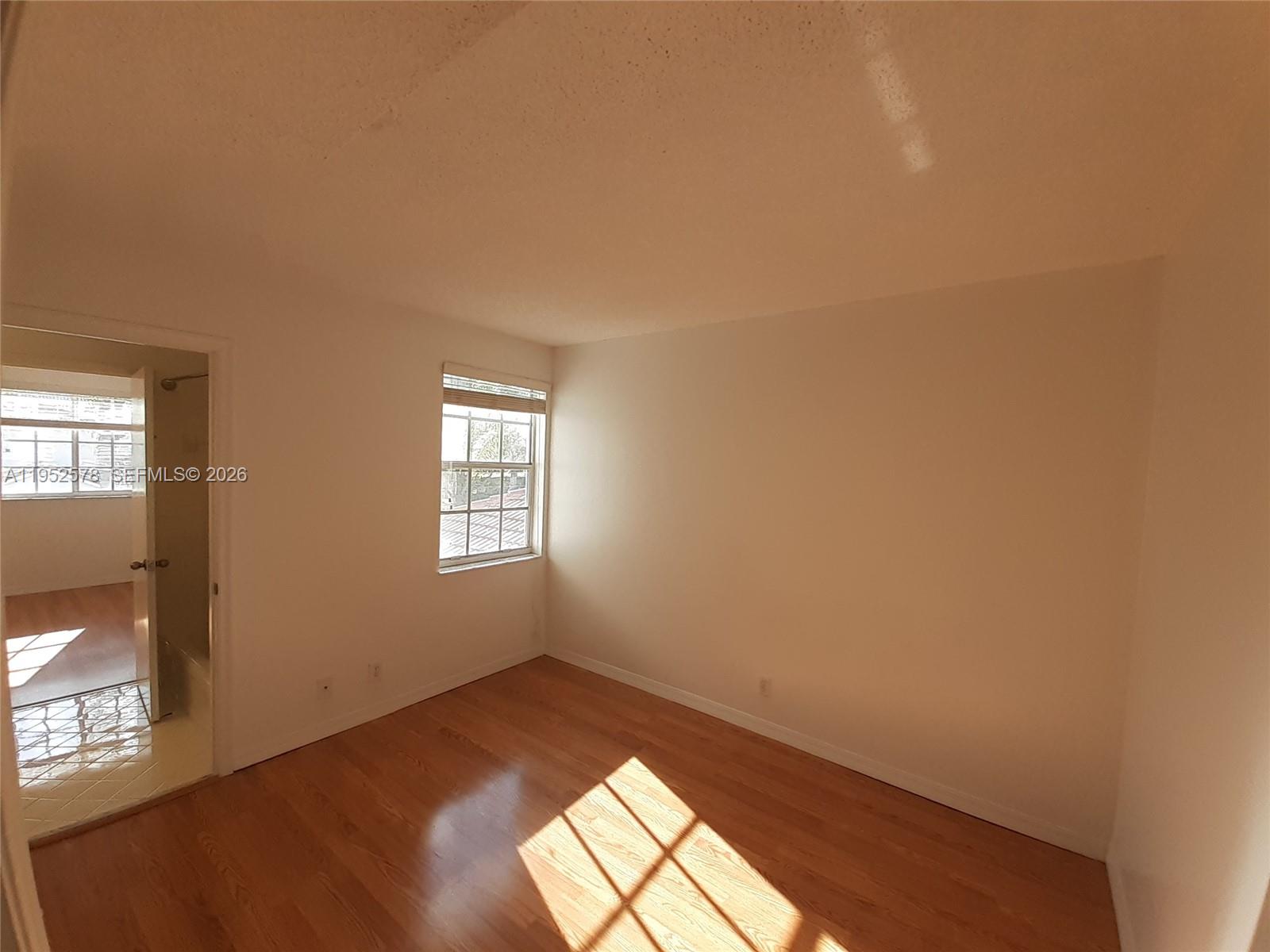 3618 San Simeon Circle, Unit 3618 Weston, FL 33331 - Photo 18 of 44 an empty room with windows