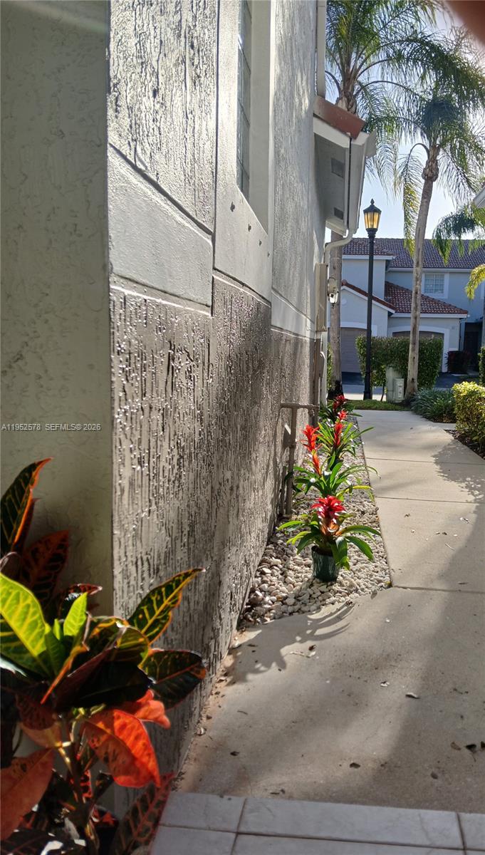 3618 San Simeon Circle, Unit 3618 Weston, FL 33331 - Photo 24 of 44 a view of path along with potted plants