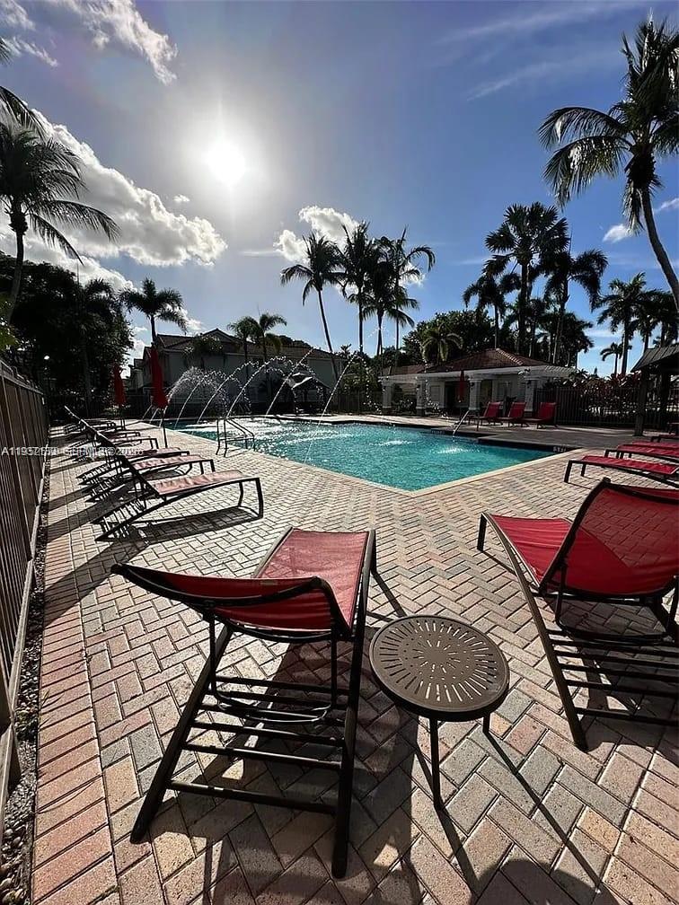 3618 San Simeon Circle, Unit 3618 Weston, FL 33331 - Photo 42 of 44 a view of a backyard with sitting area