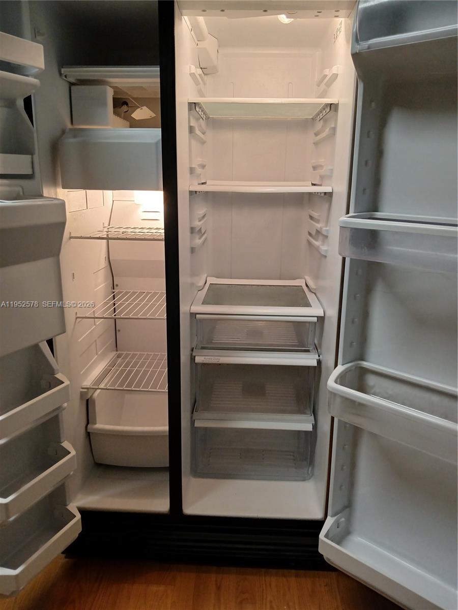 3618 San Simeon Circle, Unit 3618 Weston, FL 33331 - Photo 5 of 44 a view of walk in closet with empty racks