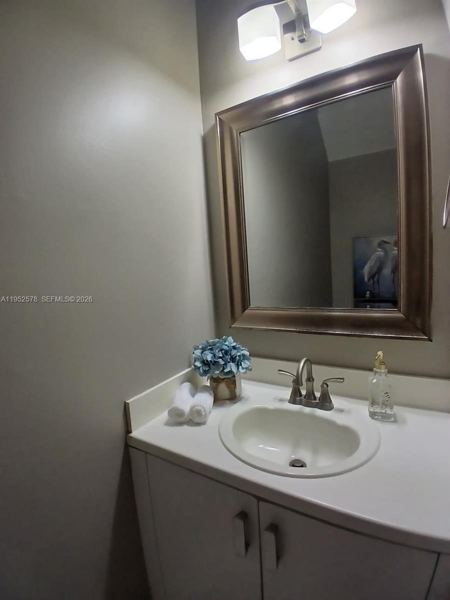 3618 San Simeon Circle, Unit 3618 Weston, FL 33331 - Photo 7 of 44 a bathroom with a sink and a mirror