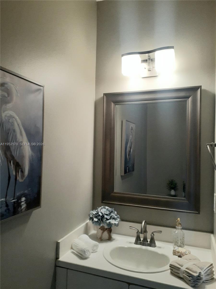 3618 San Simeon Circle, Unit 3618 Weston, FL 33331 - Photo 8 of 44 a bathroom with a sink and a mirror