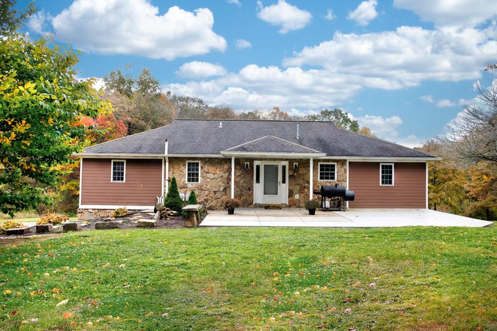 116 West Cruikshank Road Butler, PA 16002 - Photo 3 of 25 a front view of a house with garden and patio