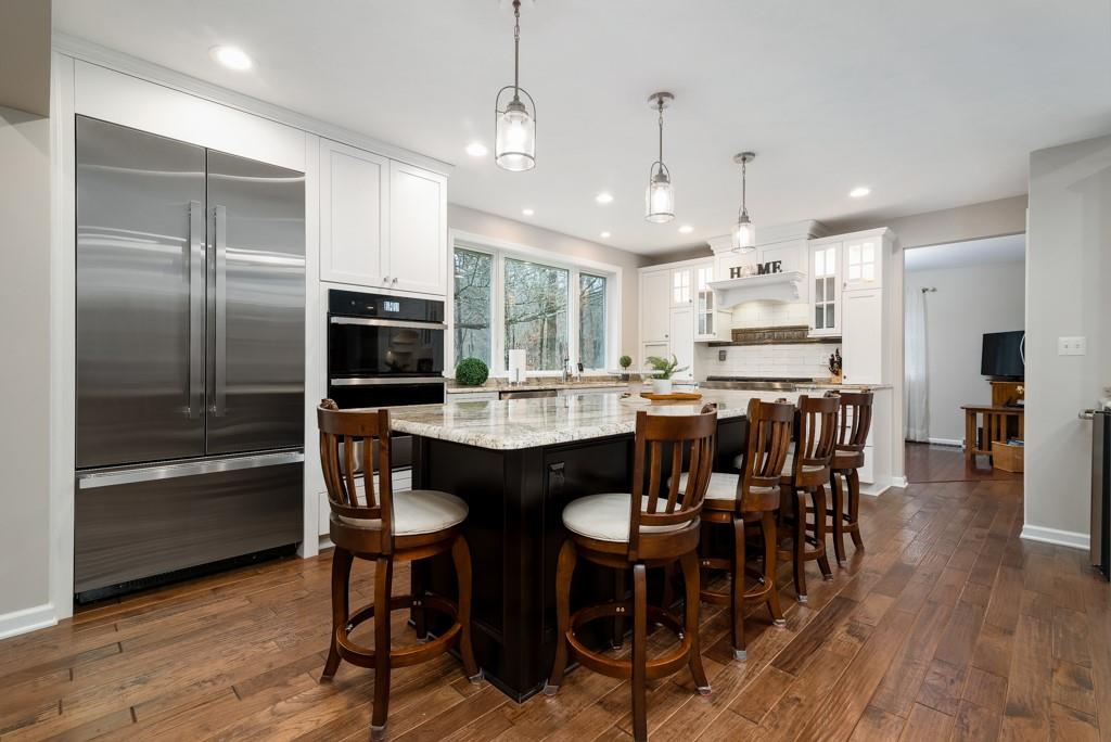 116 West Cruikshank Road Butler, PA 16002 - Photo 6 of 25 a kitchen with stainless steel appliances kitchen island granite countertop a dining table chairs refrigerator and sink