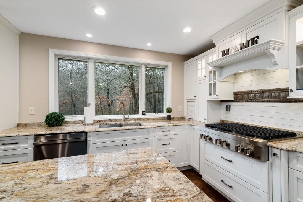 116 West Cruikshank Road Butler, PA 16002 - Photo 7 of 25 a kitchen with stainless steel appliances kitchen island granite countertop a stove and a sink