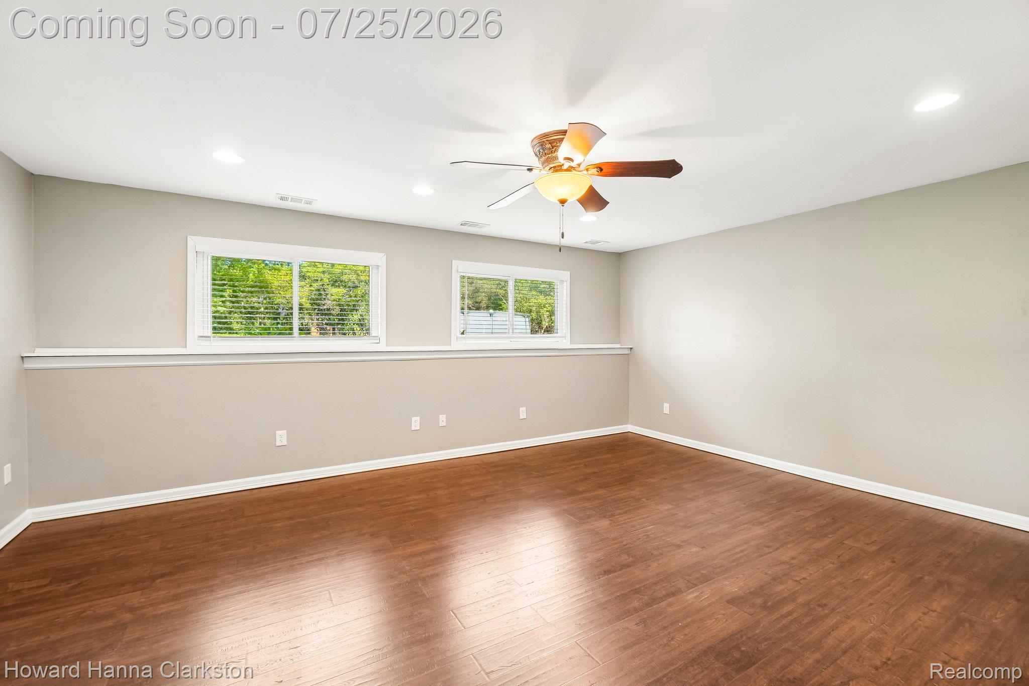 950 Beardon Road Lake Orion, MI 48362 - Photo 22 of 40 Lower level family room with windows overlooking the backyard.
