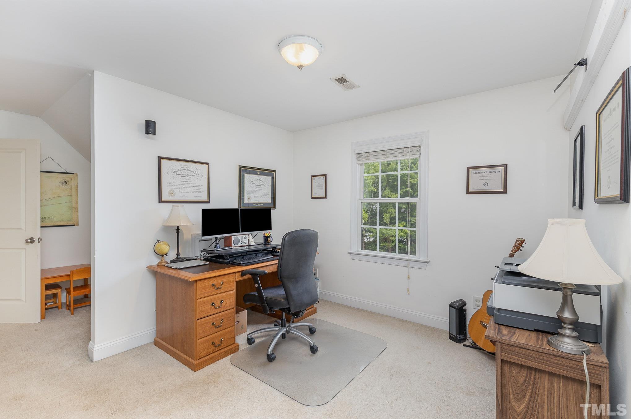 1308 Red Brick Road Garner, NC 27529 - Photo 16 of 31 a view of a workspace with furniture and a window