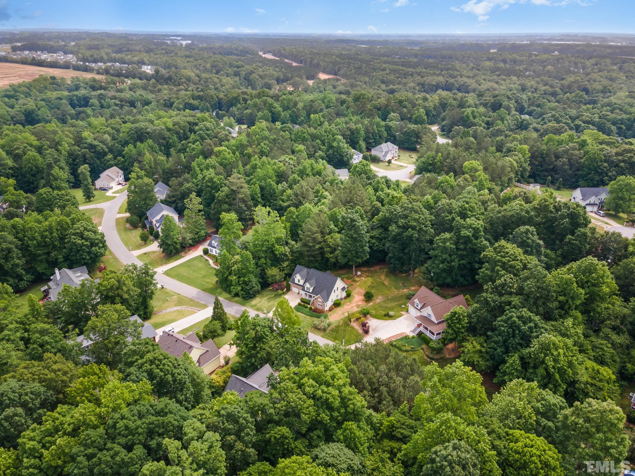 1308 Red Brick Road Garner, NC 27529 - Photo 24 of 31 an aerial view of a house with a yard