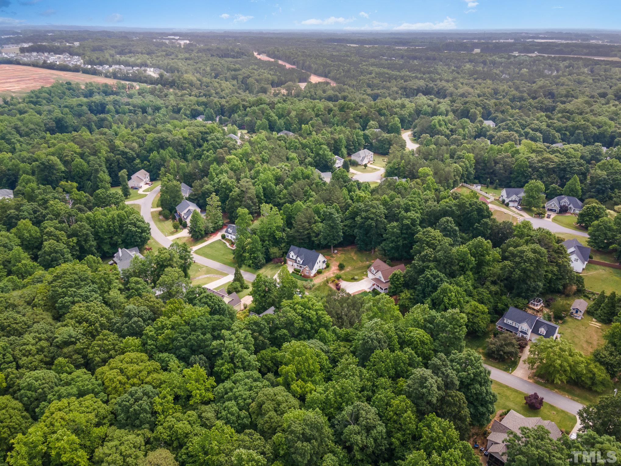 1308 Red Brick Road Garner, NC 27529 - Photo 25 of 31 an aerial view of a city with lots of residential buildings