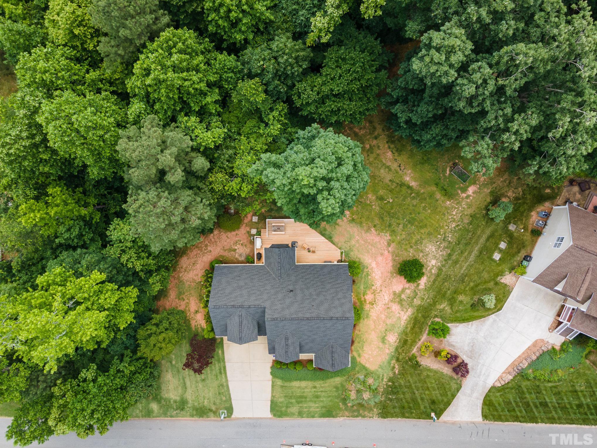 1308 Red Brick Road Garner, NC 27529 - Photo 28 of 31 an aerial view of a house with a yard and trees