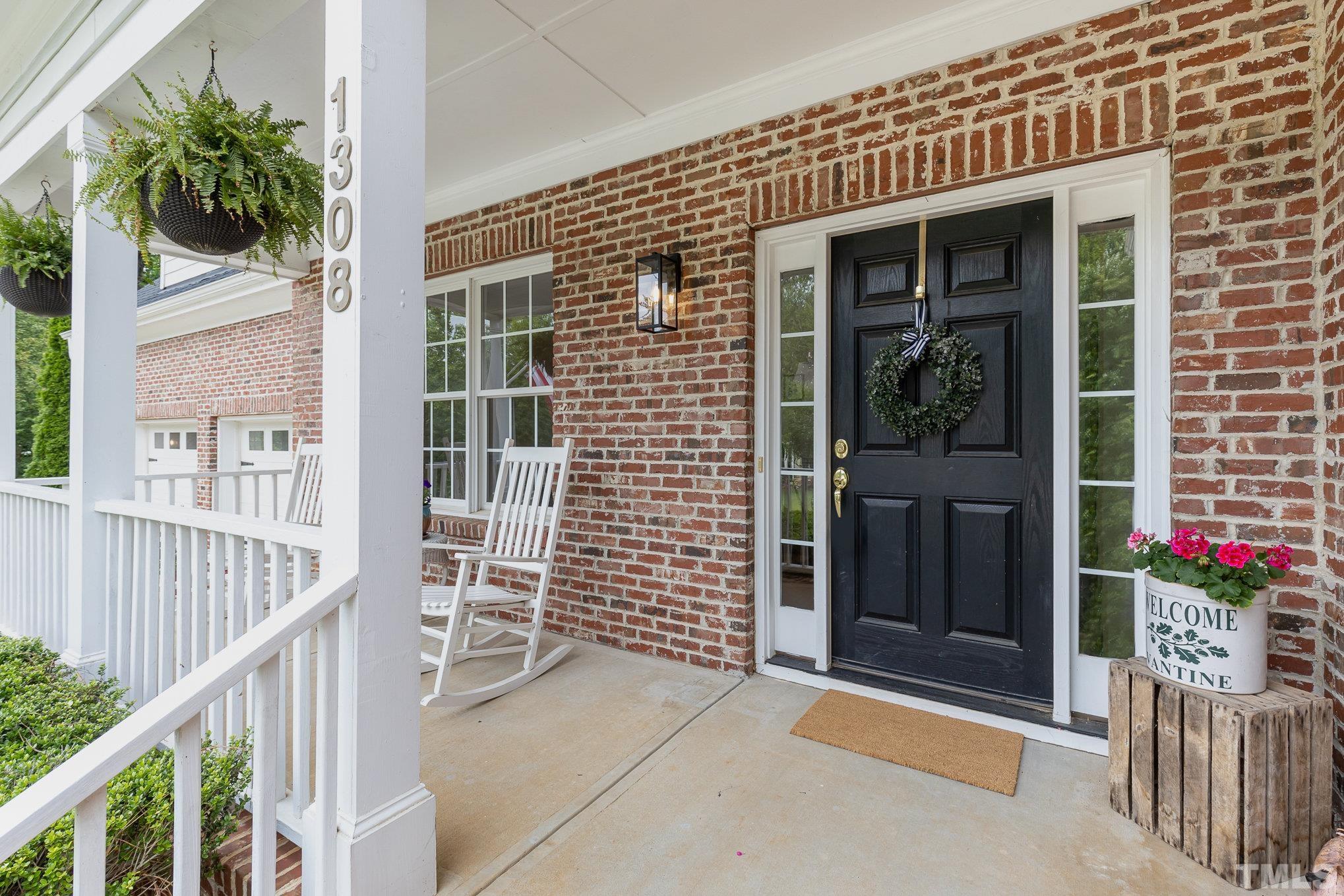 1308 Red Brick Road Garner, NC 27529 - Photo 3 of 31 a view of front door and potted plants