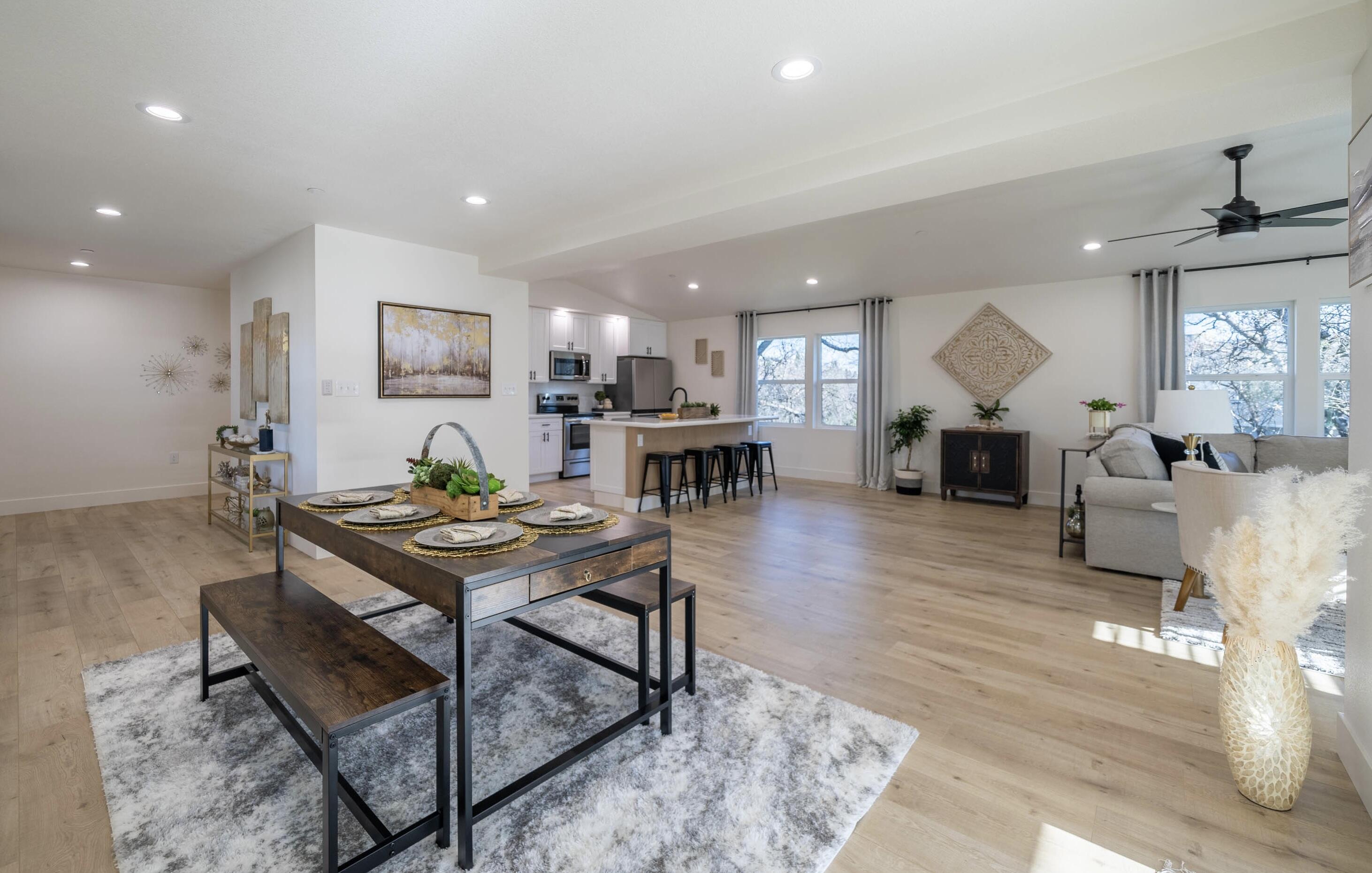 1387 Ridge Drive Redding, CA 96001 - Photo 16 of 44 a living room with furniture a table and kitchen view