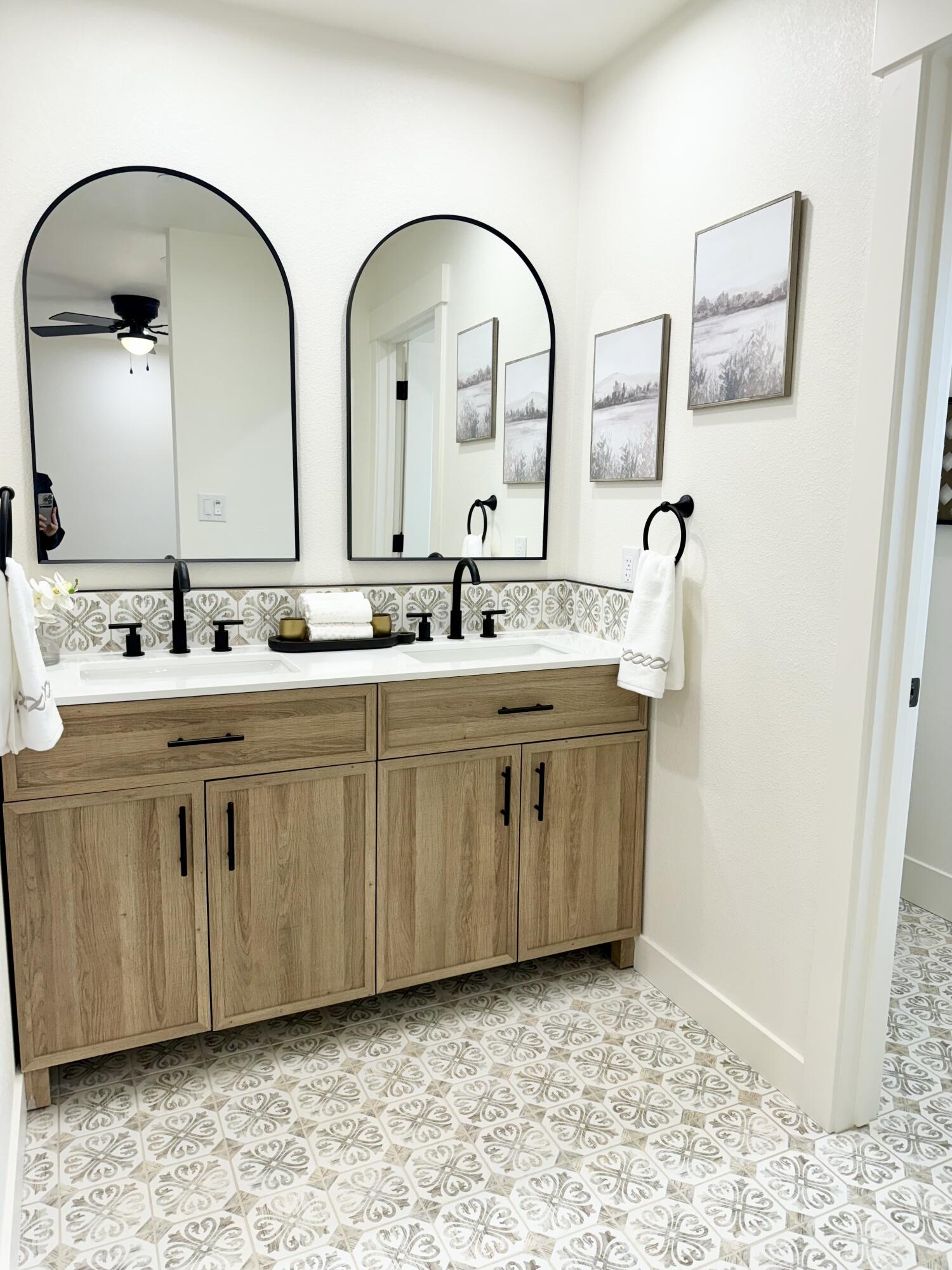 1387 Ridge Drive Redding, CA 96001 - Photo 19 of 44 a bathroom with a double vanity sink and a mirror
