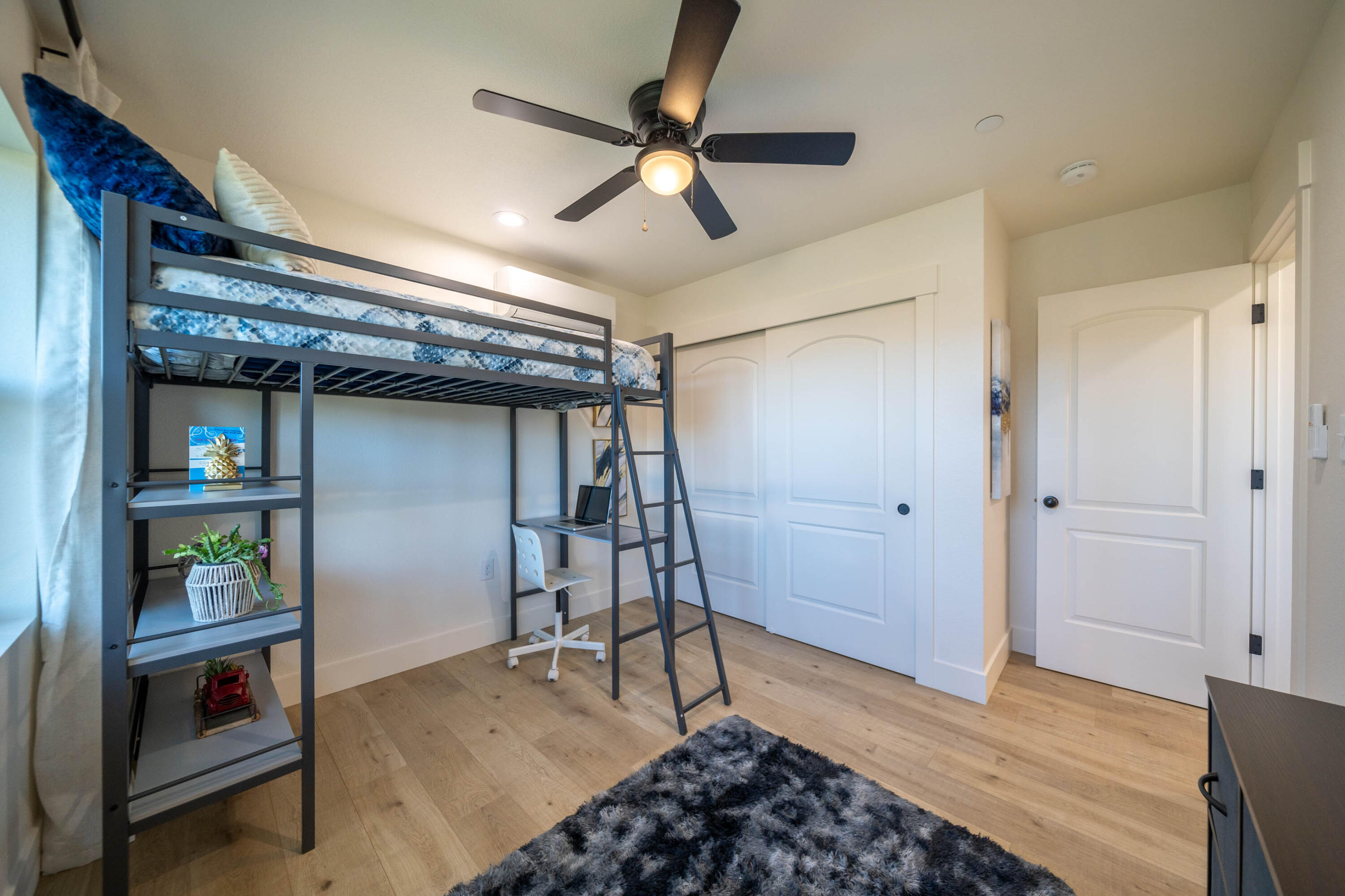 1387 Ridge Drive Redding, CA 96001 - Photo 23 of 44 a room with furniture and a ceiling fan