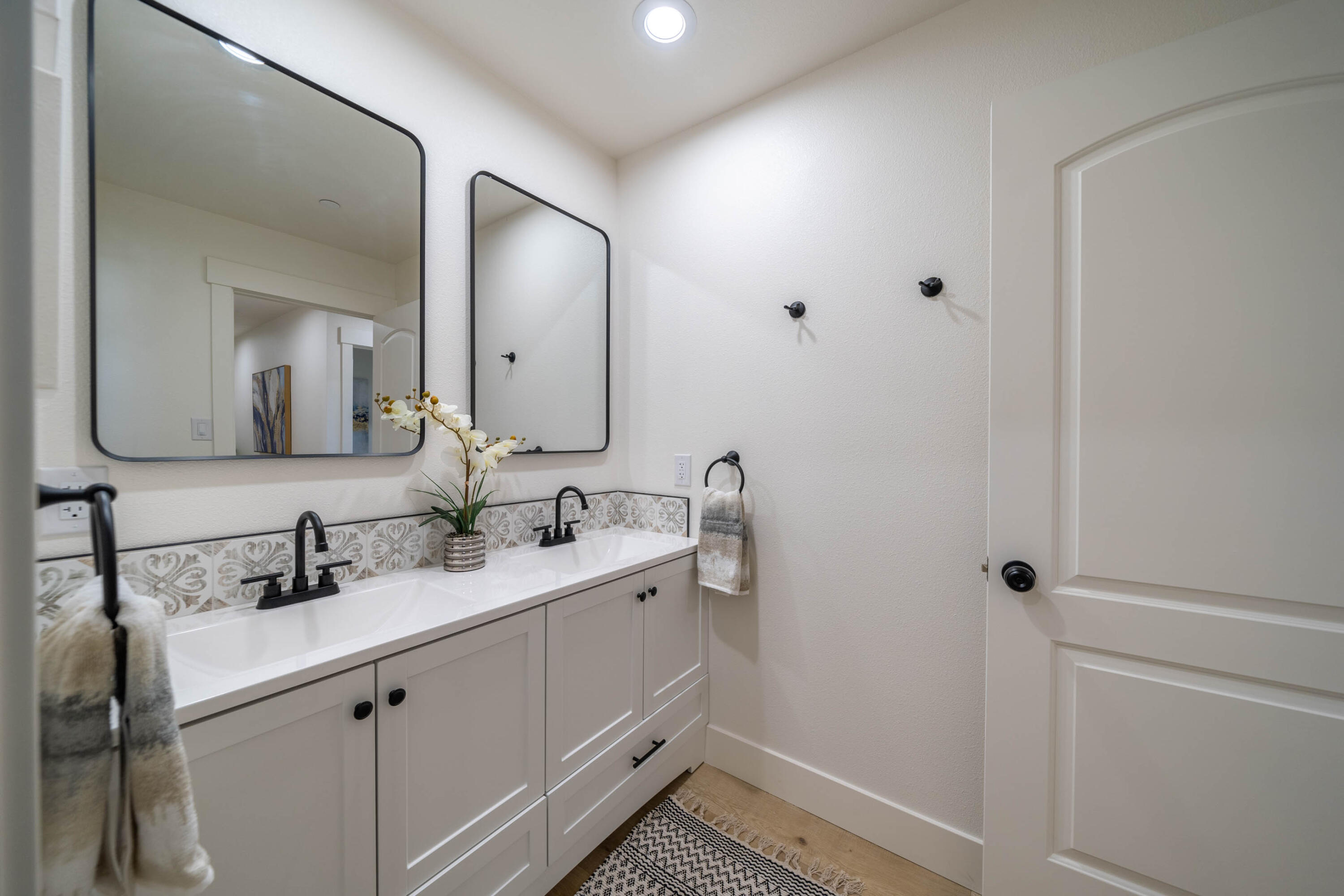 1387 Ridge Drive Redding, CA 96001 - Photo 24 of 44 a bathroom with a double vanity sink and mirror