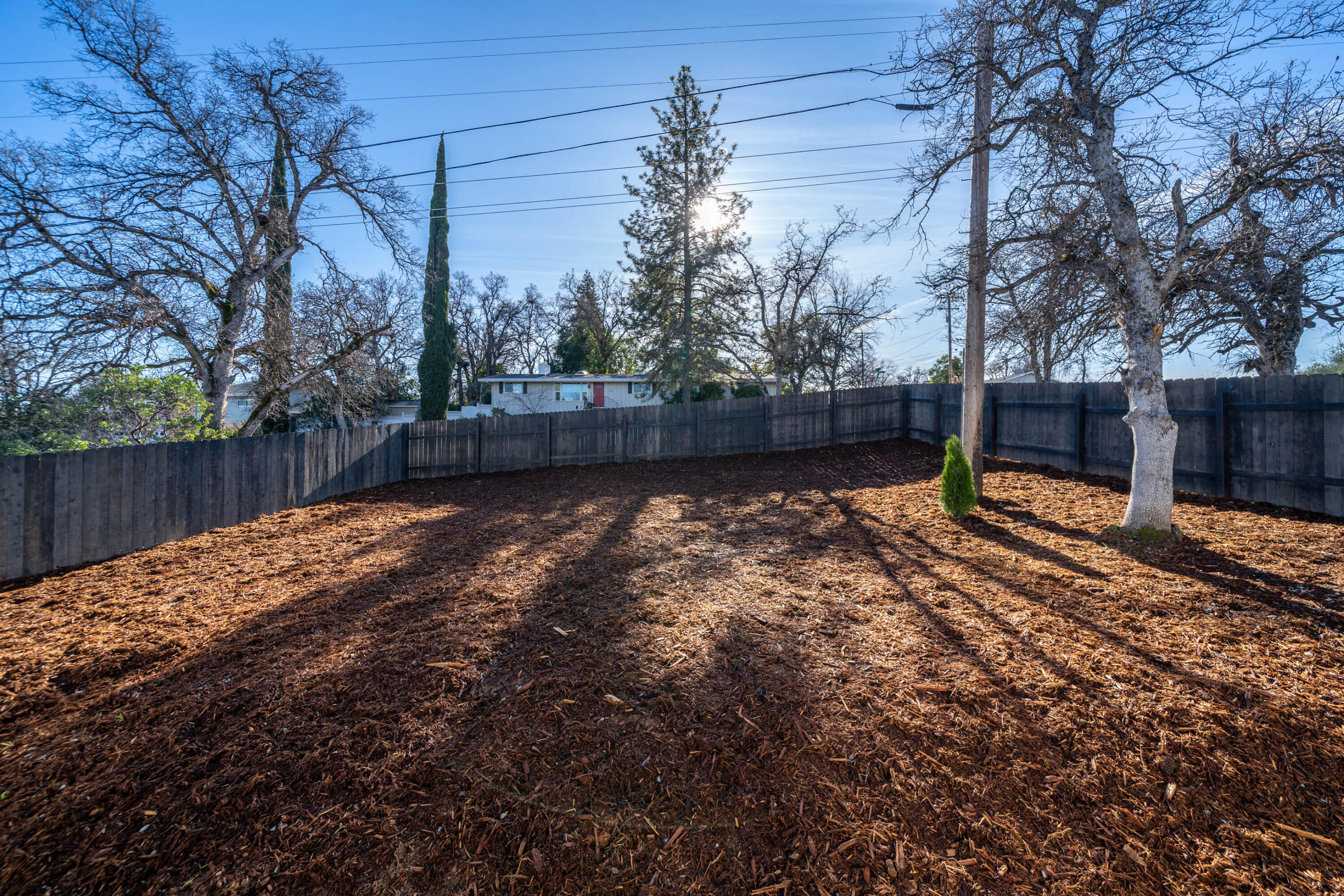 1387 Ridge Drive Redding, CA 96001 - Photo 33 of 44 a backyard of a house with lots of green space