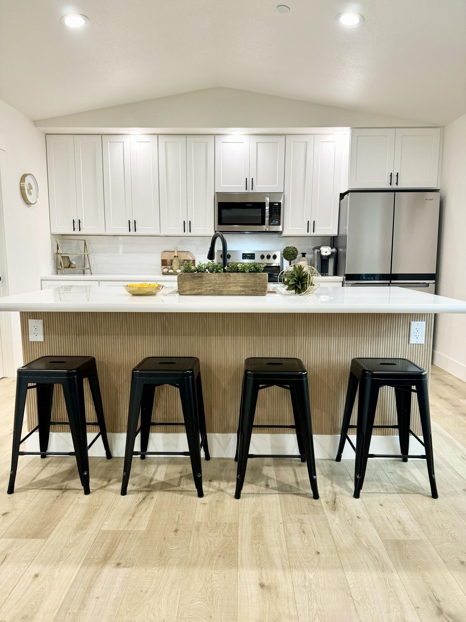 1387 Ridge Drive Redding, CA 96001 - Photo 5 of 44 a kitchen with stainless steel appliances granite countertop a table chairs sink and cabinets