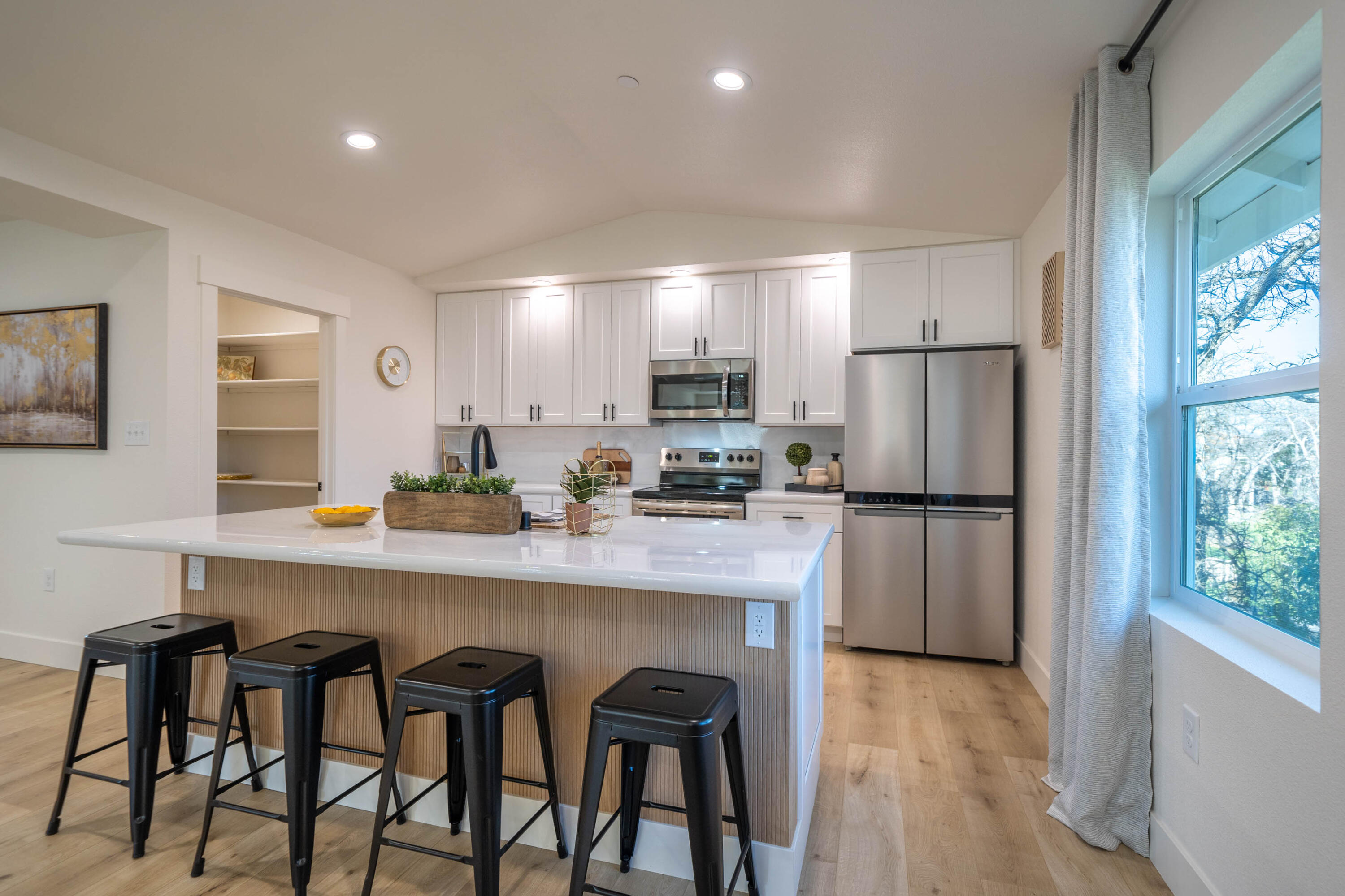 1387 Ridge Drive Redding, CA 96001 - Photo 6 of 44 a kitchen with refrigerator and window