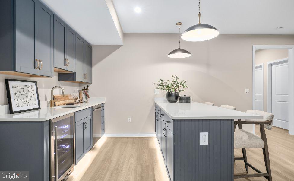 0 Hampstead Farm Stafford, VA 22556 - Photo 14 of 23 a kitchen with a sink a stove cabinets and wooden floor